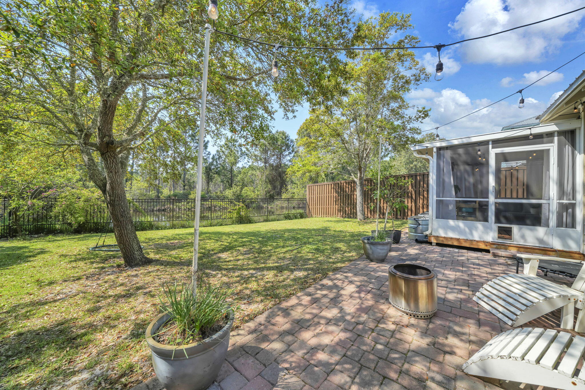 98 Bald Eagle Drive Santa Rosa Beach, FL 32459 - Photo 43 of 48 a view of a backyard with sitting area