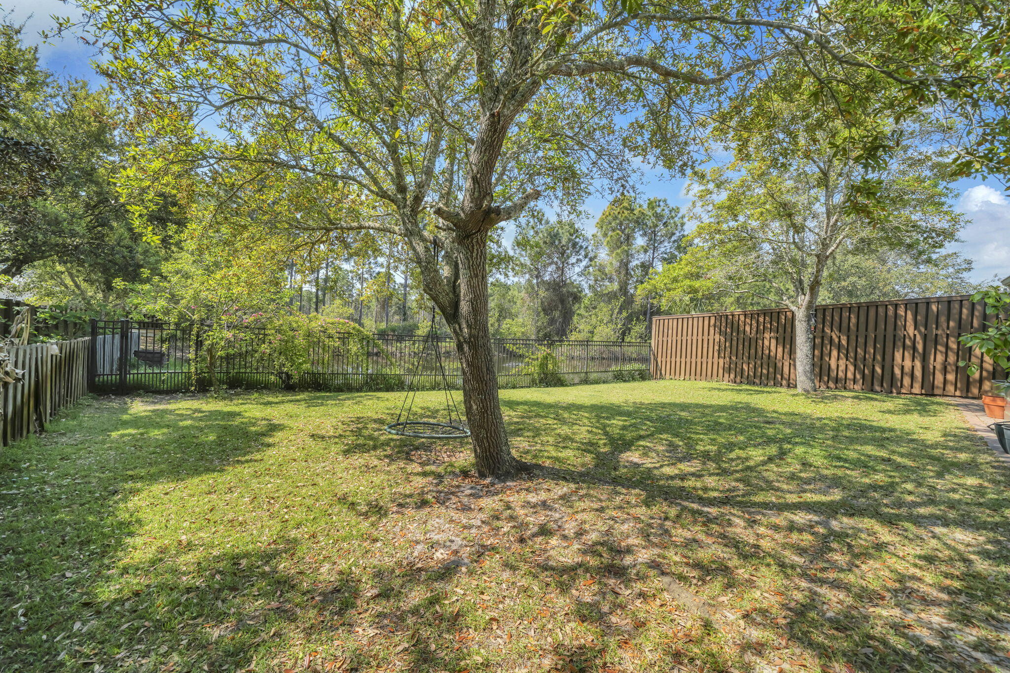 98 Bald Eagle Drive Santa Rosa Beach, FL 32459 - Photo 44 of 48 a view of a yard with a tree