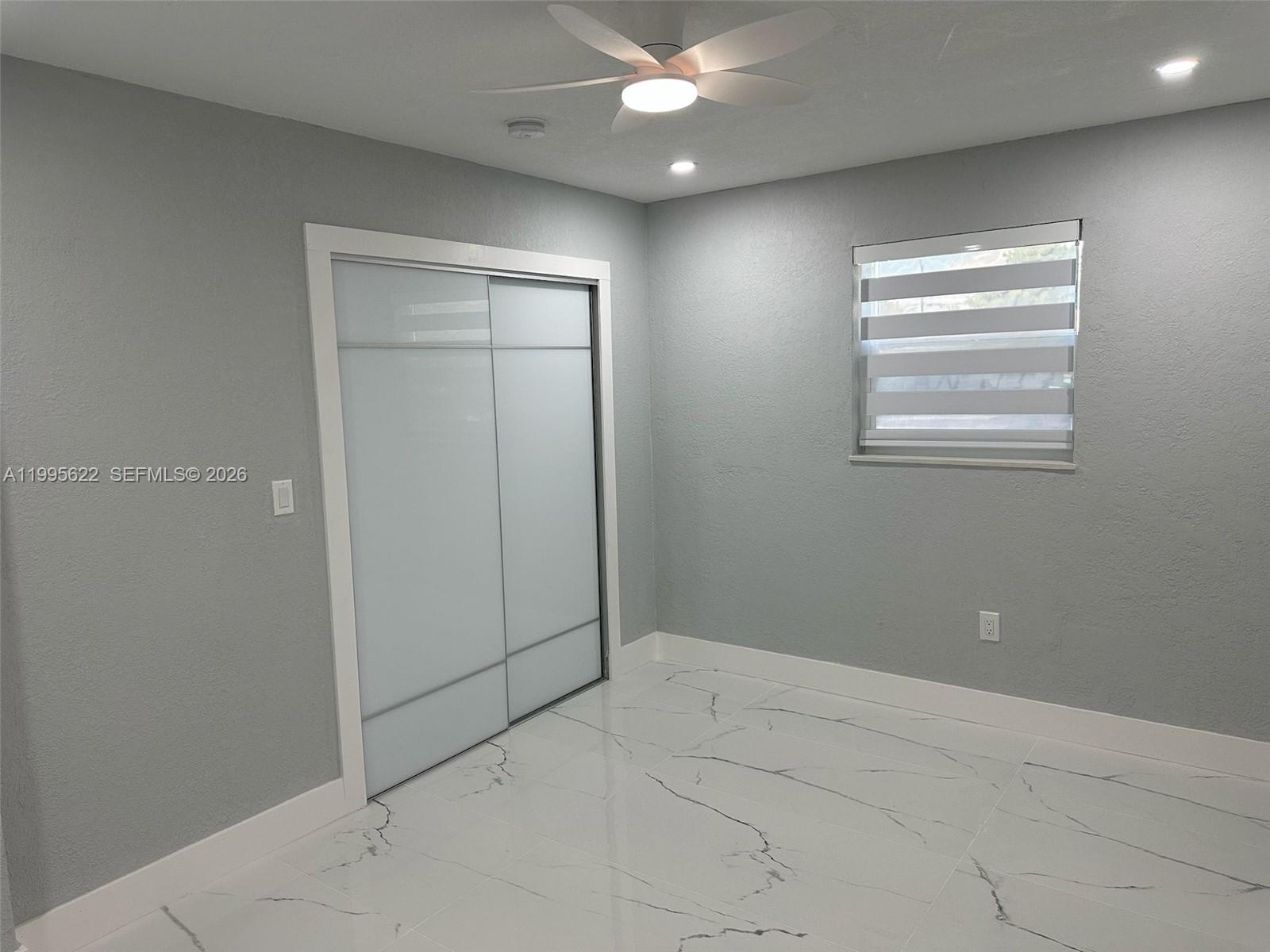 10745 Southwest 222nd Street, Unit 10745 Miami, FL 33170 - Photo 12 of 26 a view of an empty room with a window
