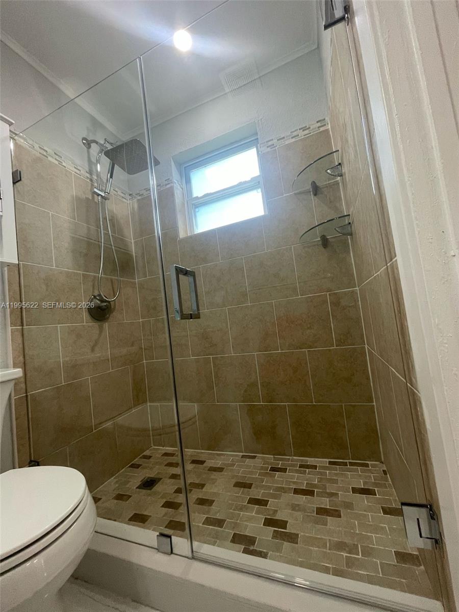 10745 Southwest 222nd Street, Unit 10745 Miami, FL 33170 - Photo 17 of 26 a bathroom with a toilet and a shower