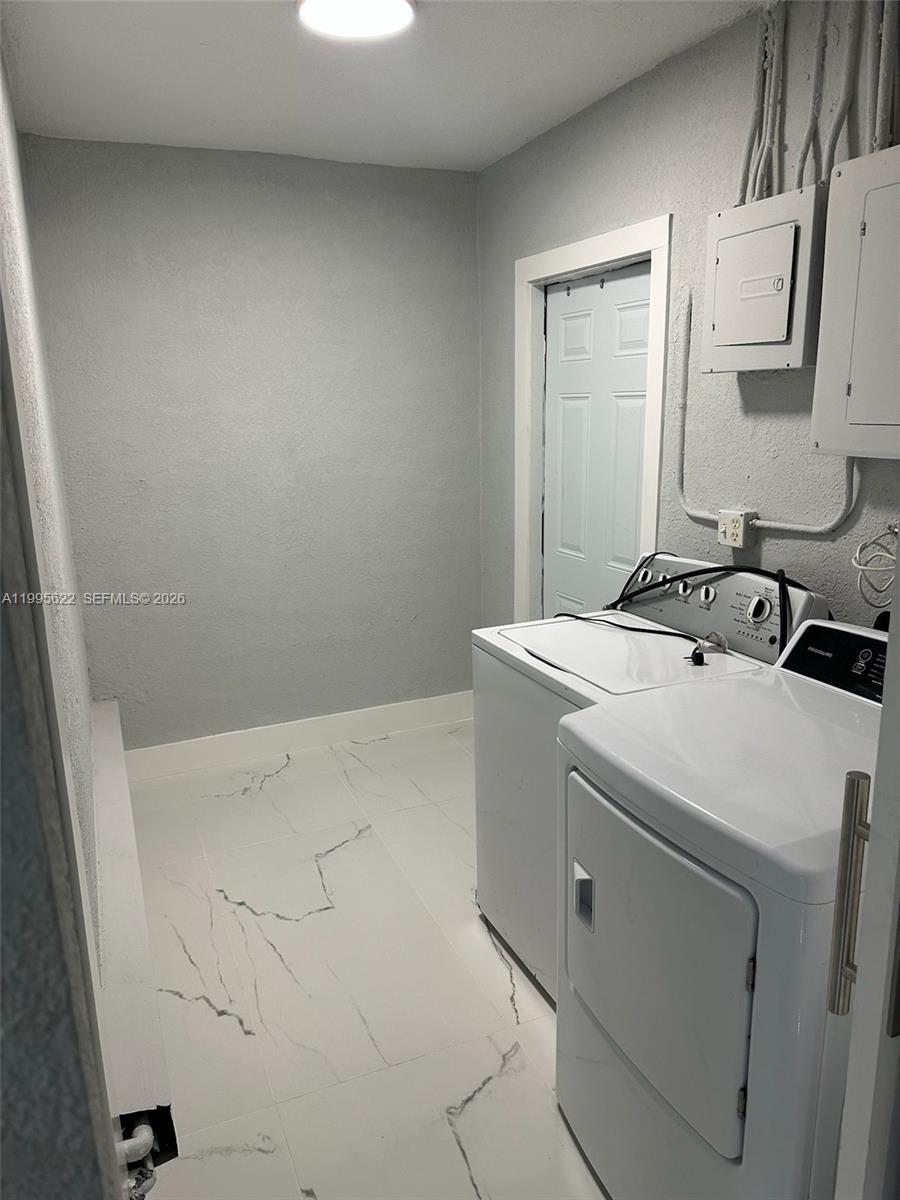 10745 Southwest 222nd Street, Unit 10745 Miami, FL 33170 - Photo 19 of 26 a utility room with dryer and washer