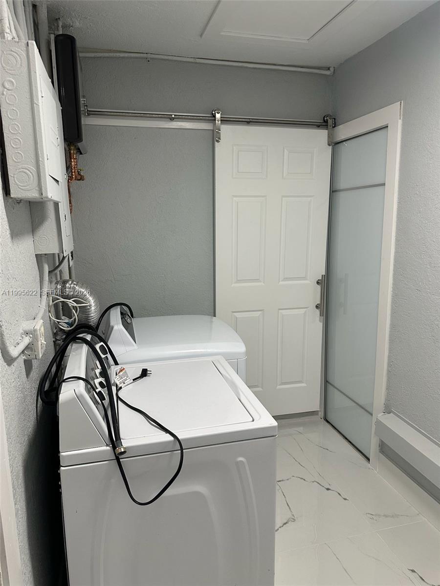 10745 Southwest 222nd Street, Unit 10745 Miami, FL 33170 - Photo 20 of 26 a bathroom with a shower and a sink