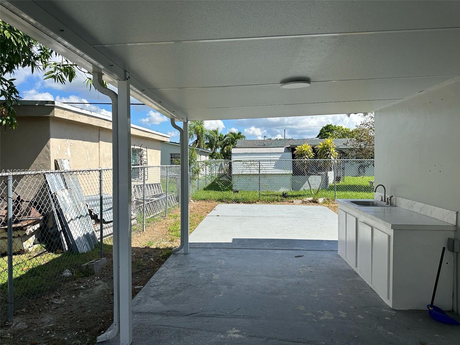 10745 Southwest 222nd Street, Unit 10745 Miami, FL 33170 - Photo 21 of 26 a house view with a garden space
