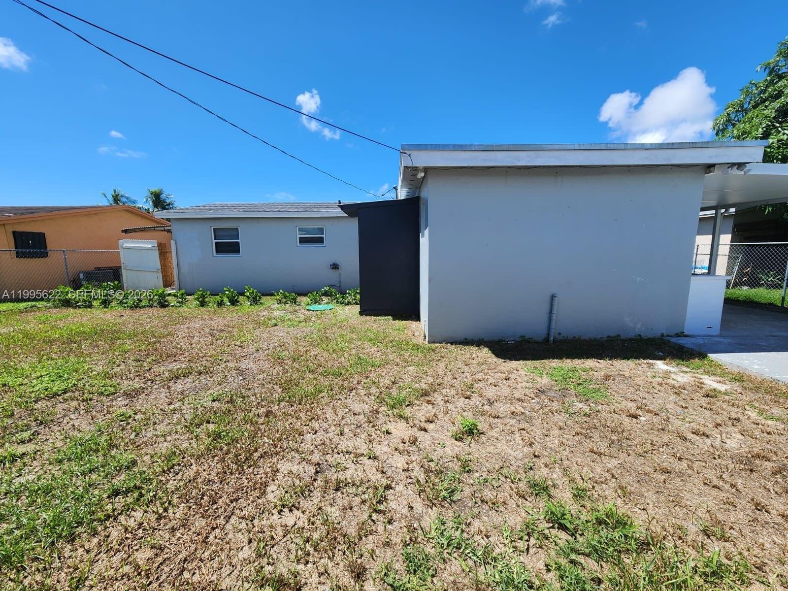10745 Southwest 222nd Street, Unit 10745 Miami, FL 33170 - Photo 23 of 26 a backyard of a house