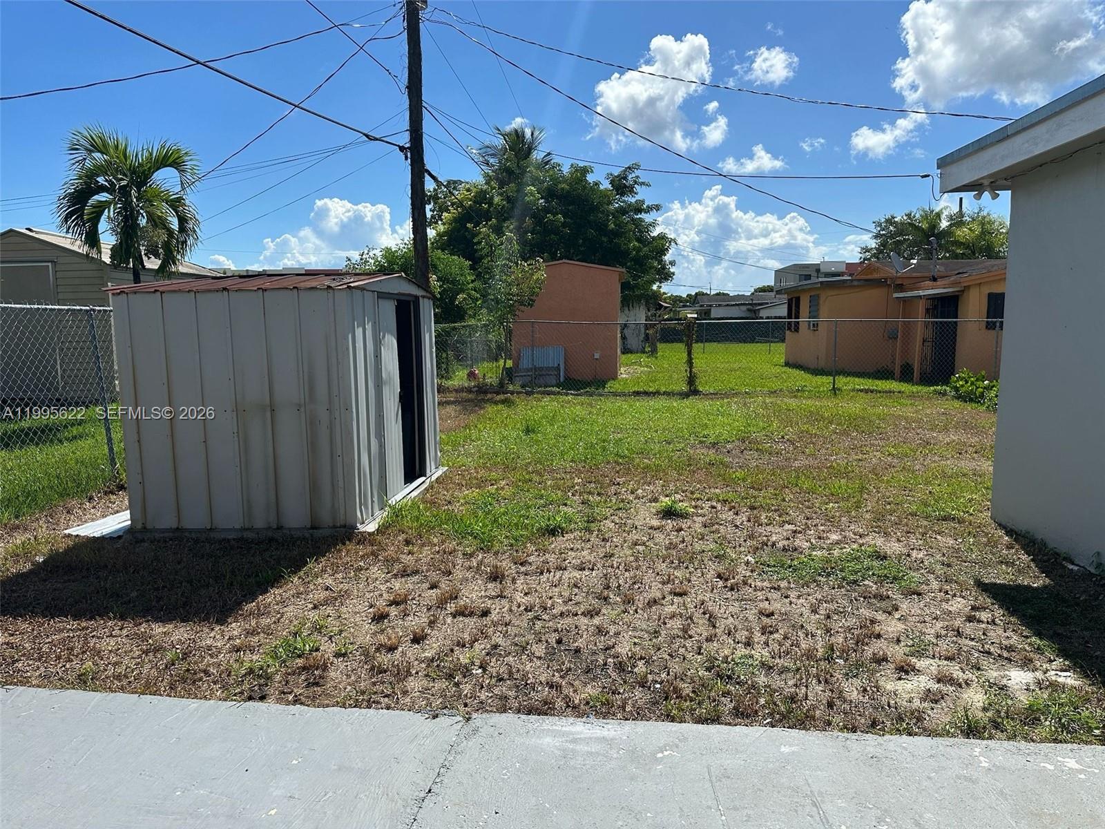 10745 Southwest 222nd Street, Unit 10745 Miami, FL 33170 - Photo 24 of 26 a view of a backyard with potted plants