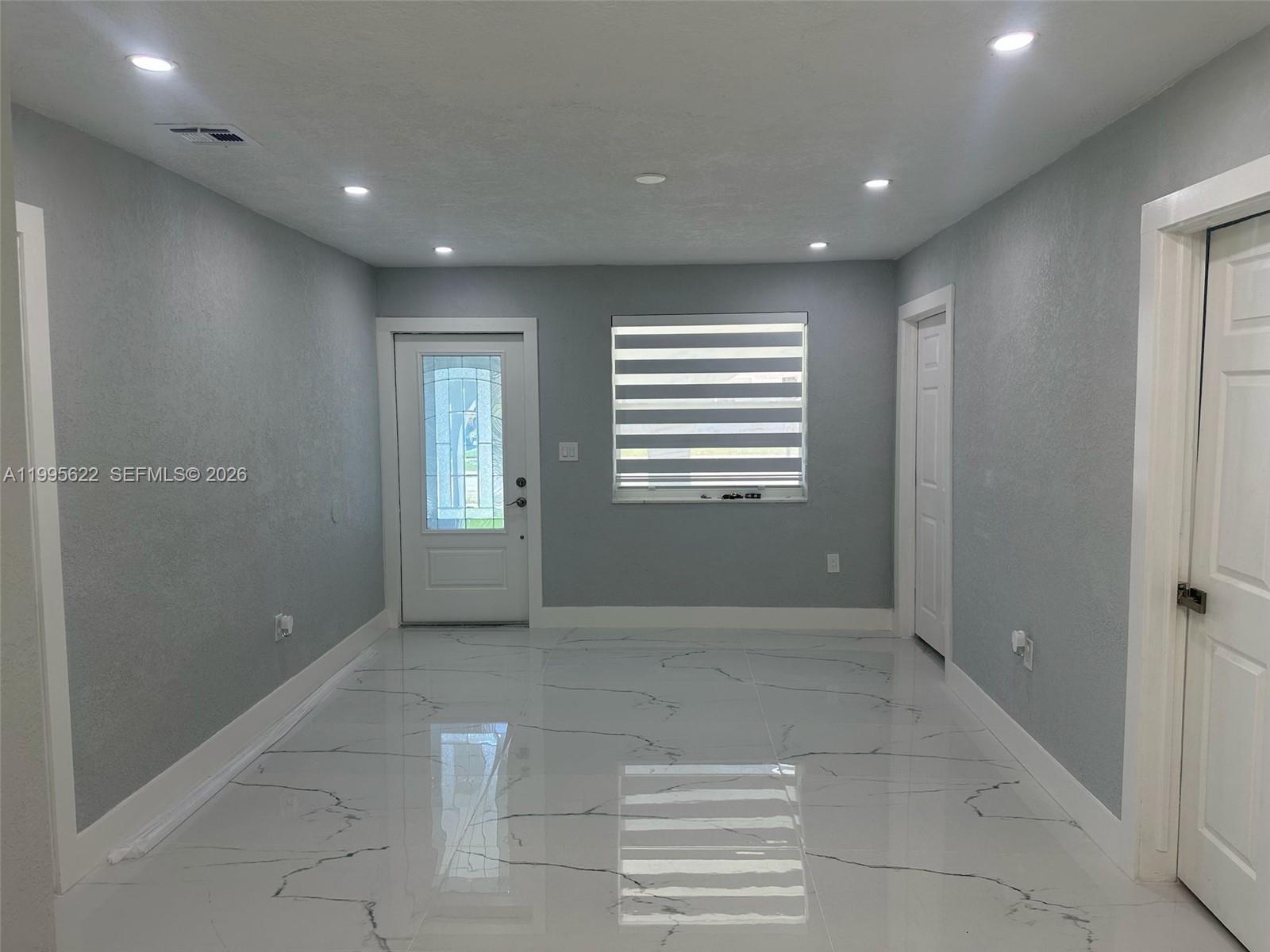 10745 Southwest 222nd Street, Unit 10745 Miami, FL 33170 - Photo 3 of 26 a view of entryway with window