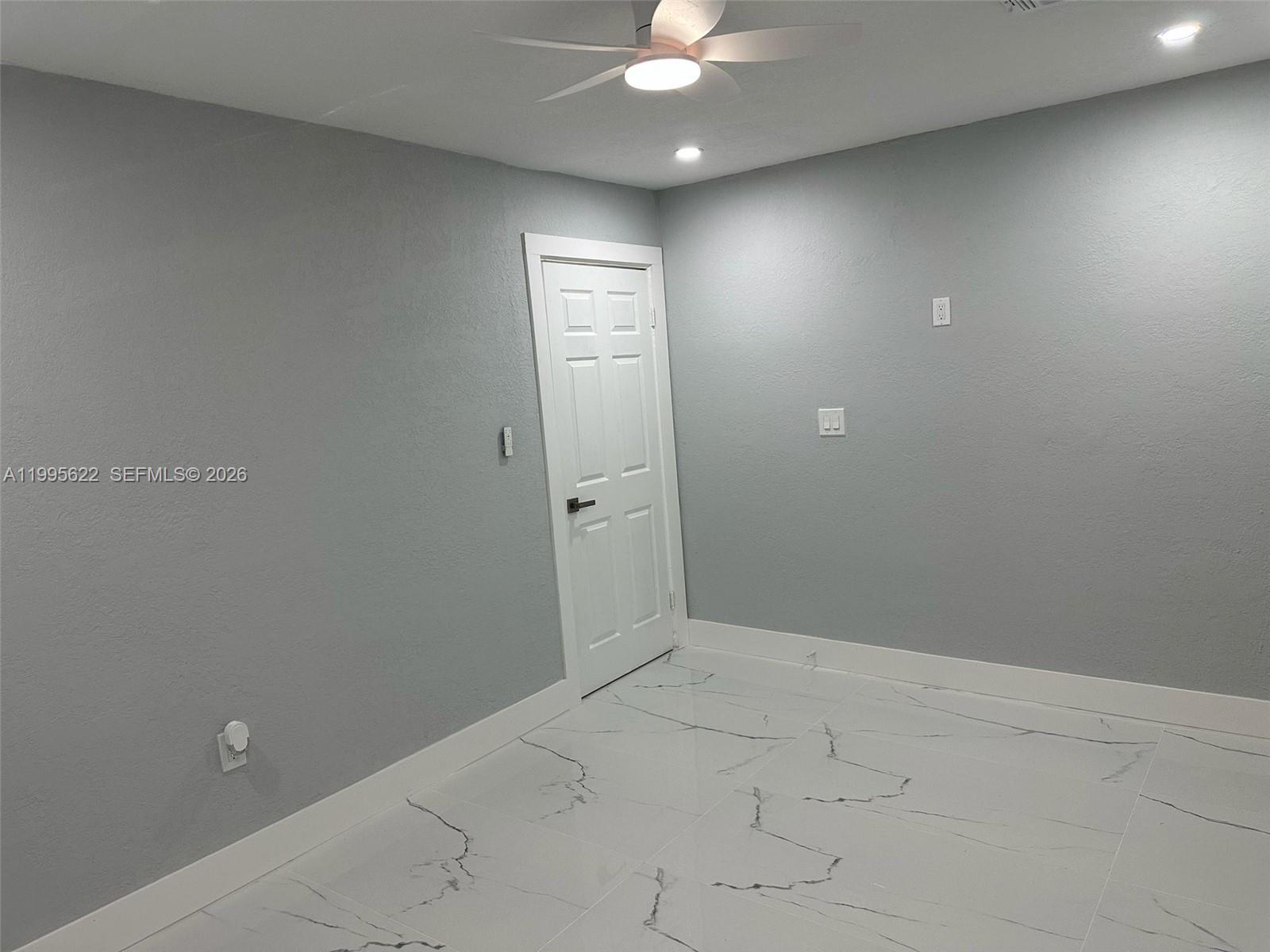 10745 Southwest 222nd Street, Unit 10745 Miami, FL 33170 - Photo 10 of 26 an empty room with a bathroom