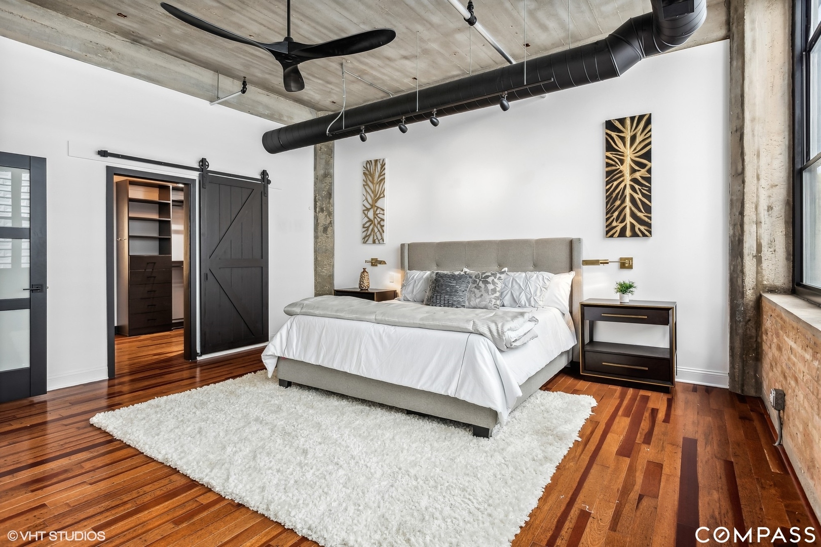 850 West Adams Street, Unit 2E Chicago, IL 60607 - Photo 20 of 36 a bedroom with a bed and wooden floor