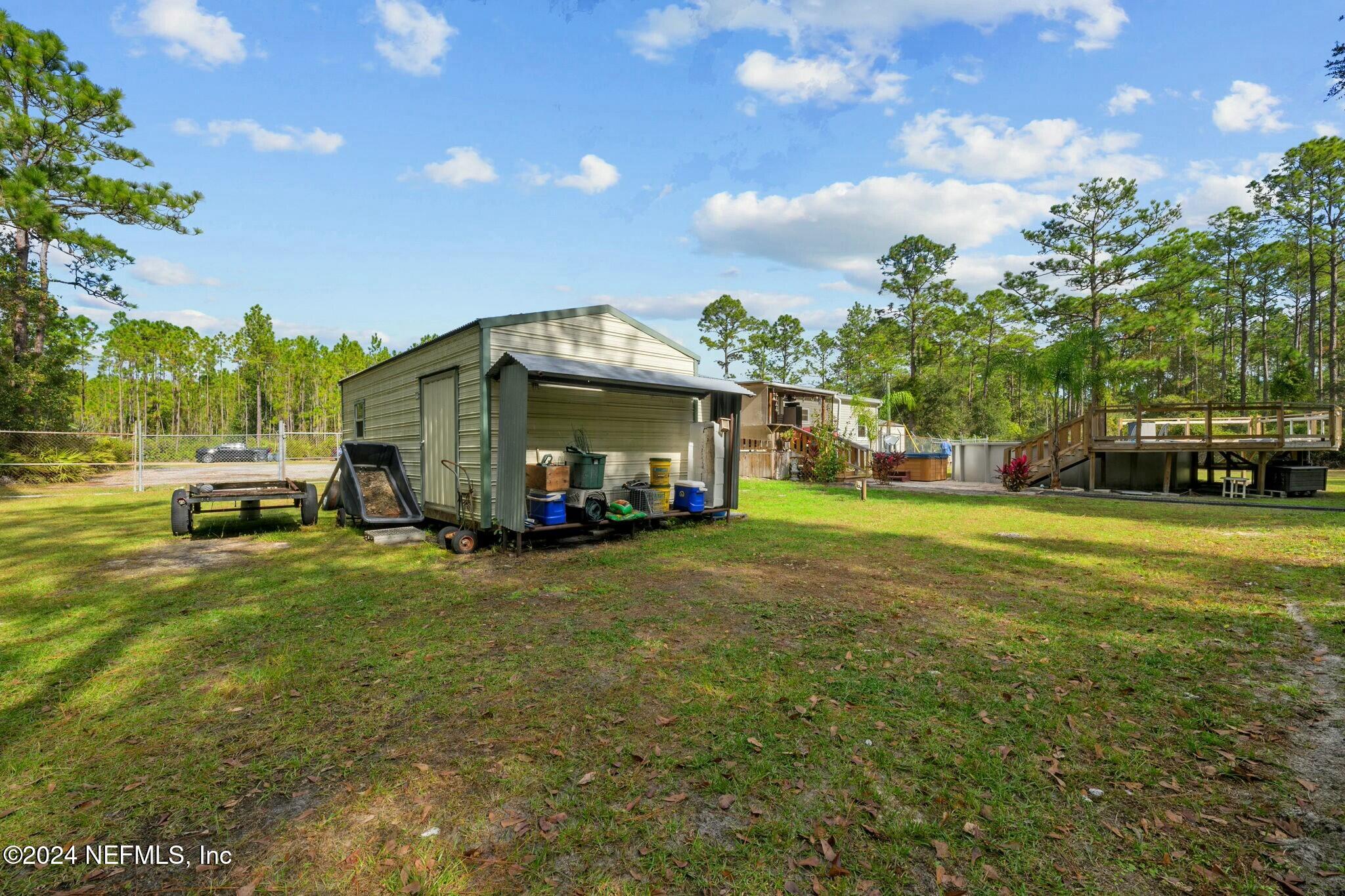 135 East Satsuma Road Palatka, FL 32177 - Photo 27 of 32 Backyard with shed