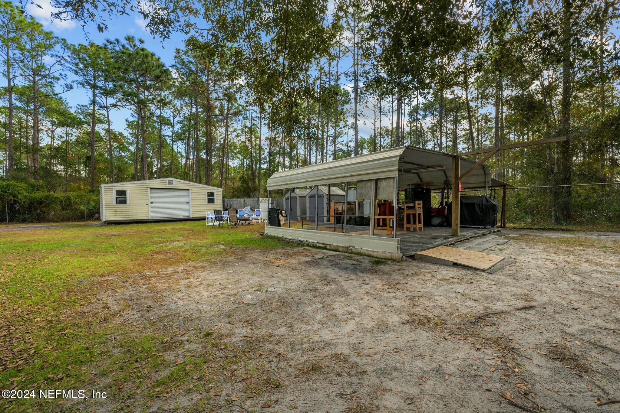 135 East Satsuma Road Palatka, FL 32177 - Photo 28 of 32 Entertaining area & additional shed