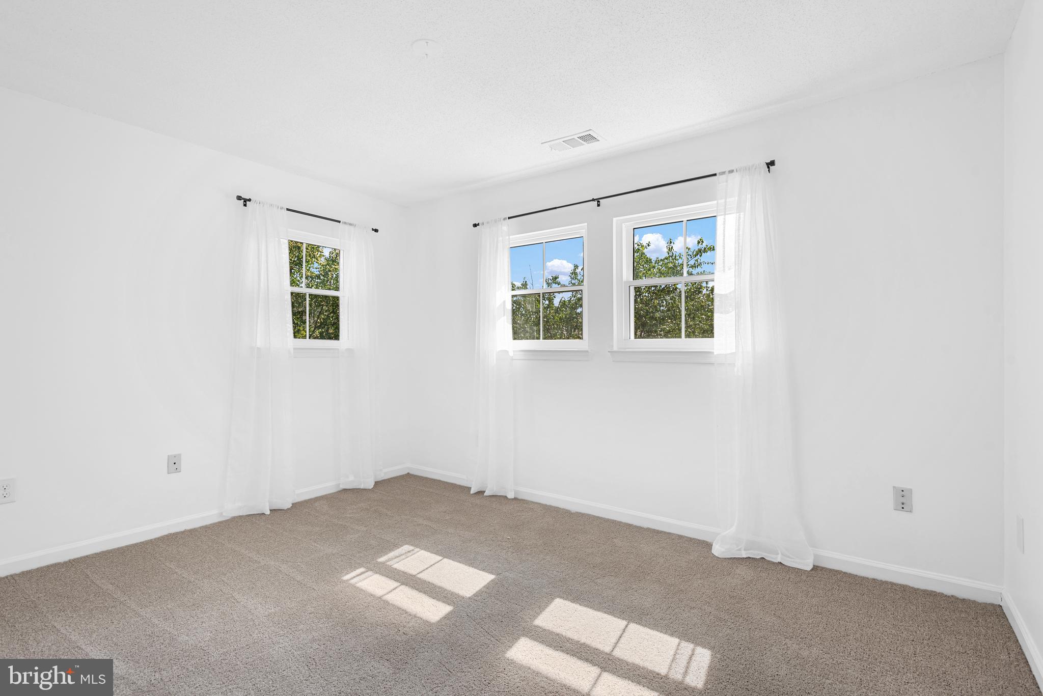 12004 Taliesin Place, Unit 32 Reston, VA 20190 - Photo 14 of 26 a view of an empty room with a window
