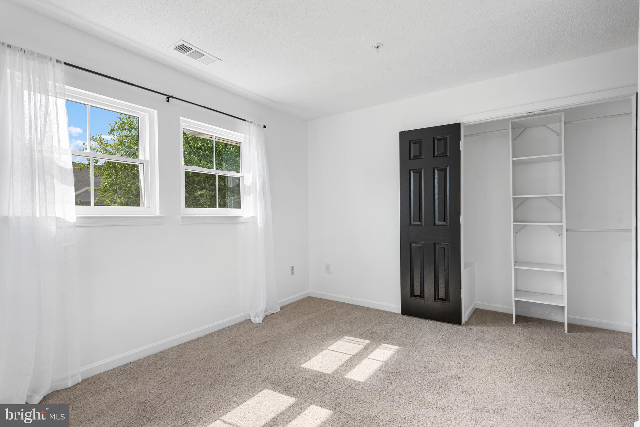 12004 Taliesin Place, Unit 32 Reston, VA 20190 - Photo 15 of 26 an empty room with windows