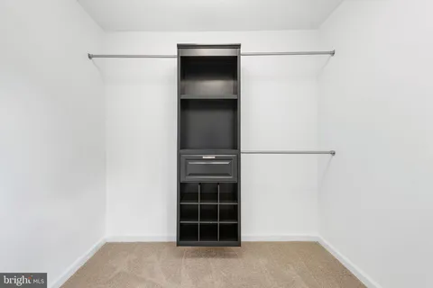 a view of an empty room with a cabinet
