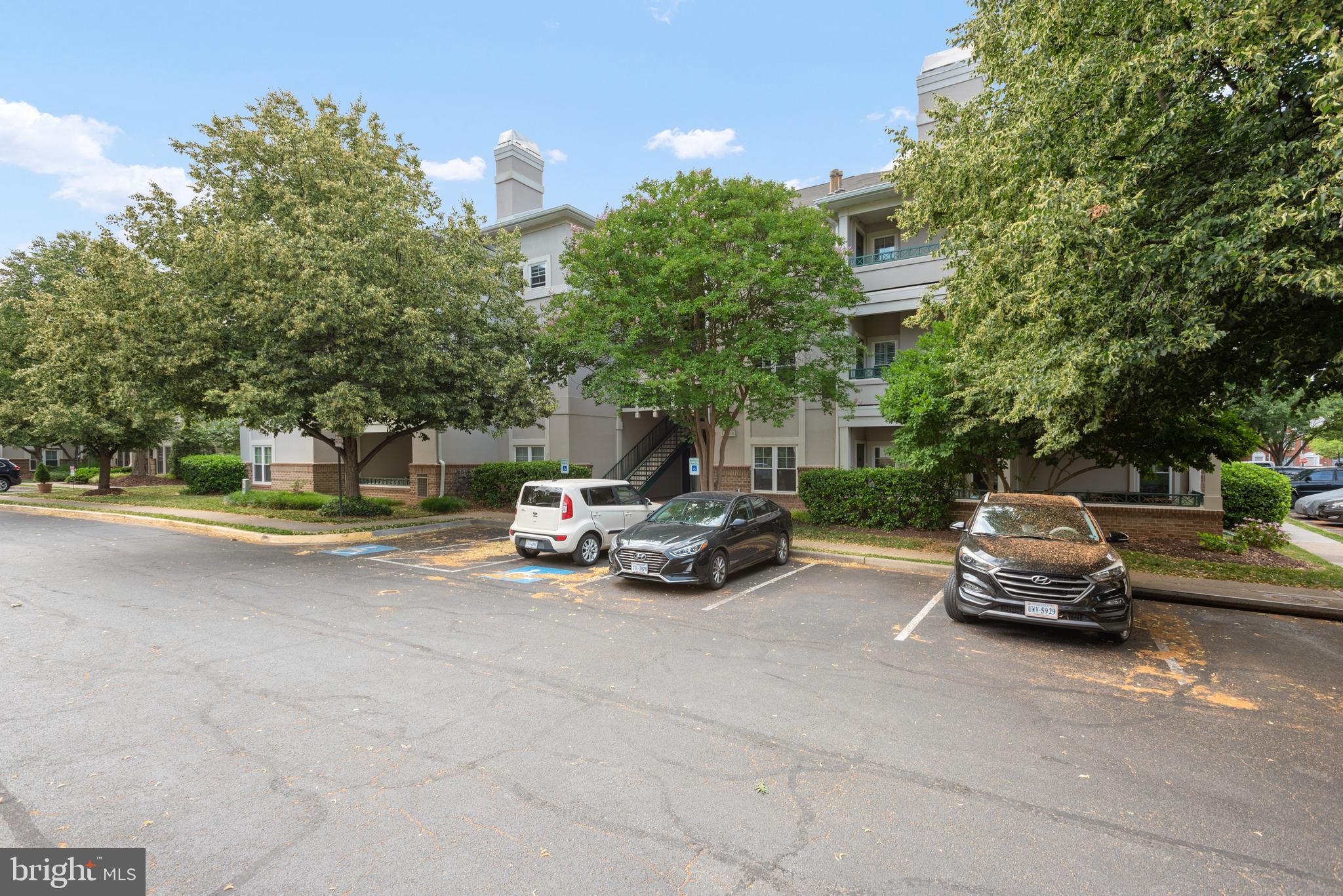12004 Taliesin Place, Unit 32 Reston, VA 20190 - Photo 3 of 26 a car parked on the side of the road
