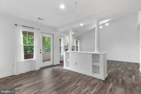 a view of kitchen and wooden floor