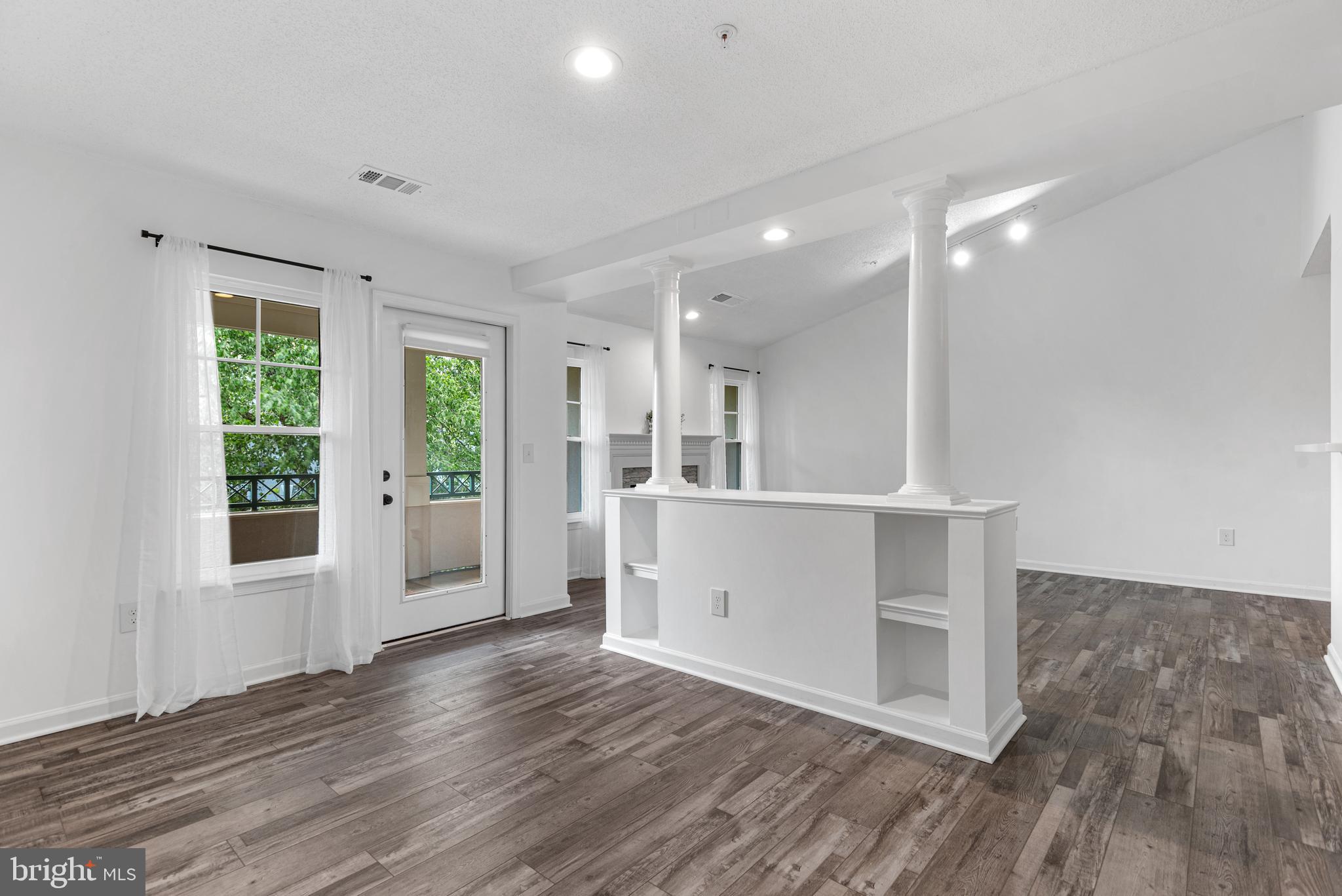 12004 Taliesin Place, Unit 32 Reston, VA 20190 - Photo 7 of 26 a view of kitchen and wooden floor