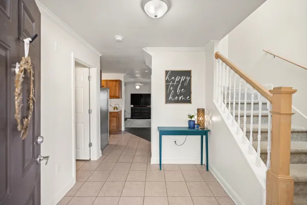a view of entryway and hall with dining room