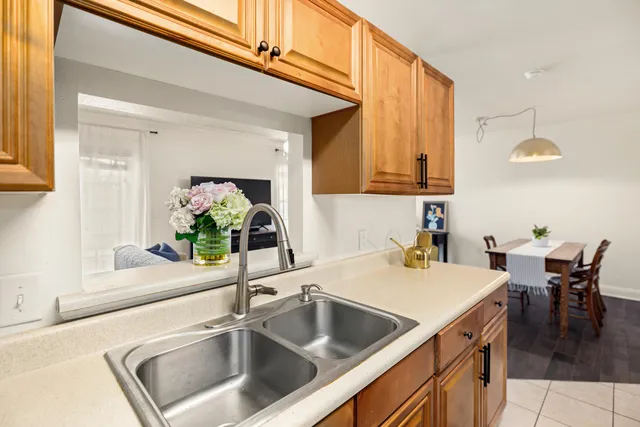 a kitchen with a sink and a refrigerator