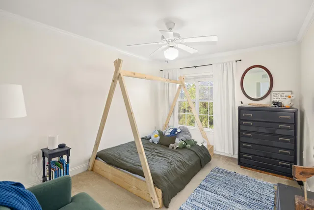 a bed room with a bed and a window