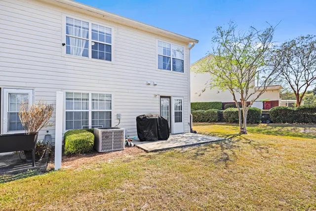 a view of a house with backyard and swimming pool