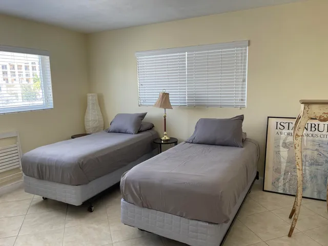 a view of a room with furniture and a window