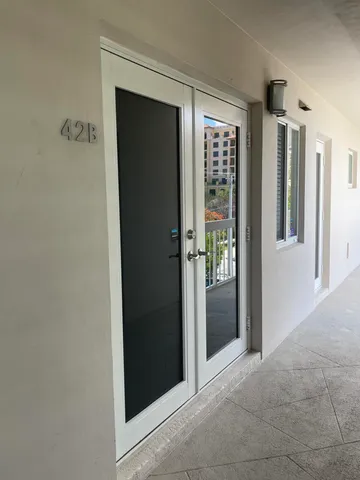 a view of an entryway with wooden floor
