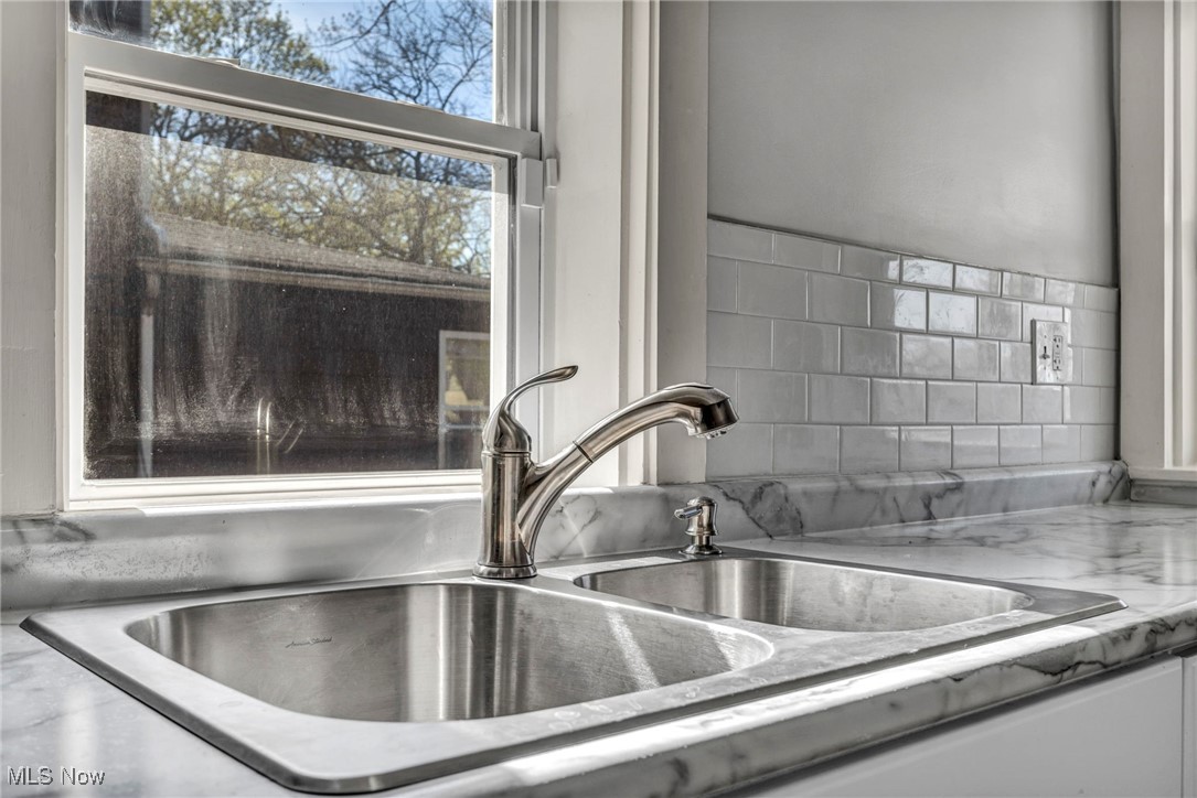3239 Sycamore Road Cleveland, OH 44118 - Photo 12 of 49 Interior details with a sink and light countertops