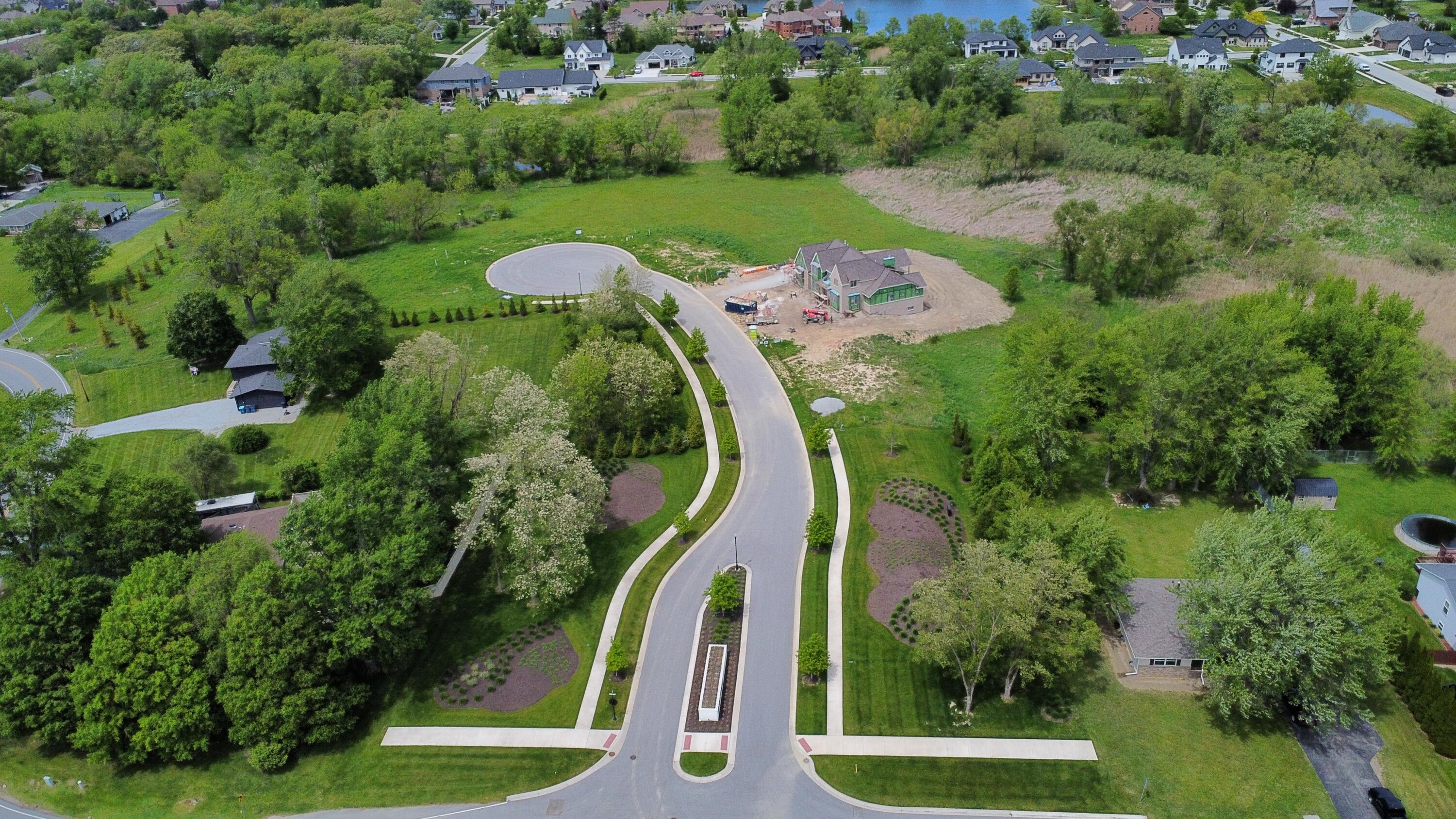 9245 Sublime Court St. John, IN 46373 - Photo 5 of 5 an aerial view of a golf course with swimming pool