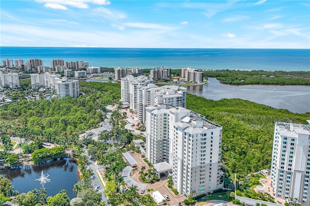 a view of a lake with tall building
