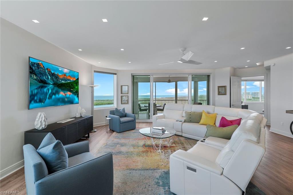 275 Indies Way, Unit 1701 Naples, FL 34110 - Photo 6 of 32 a living room with furniture and a flat screen tv