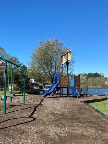 a view of a park with swings and slides
