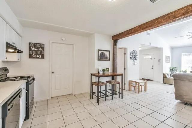 a view of a livingroom with furniture and lounge chair