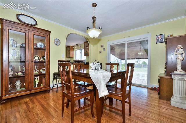 8515 Mohawk Road Colorado Springs, CO 80908 - Photo 6 of 28 Formal dining room with walk out to covered patio