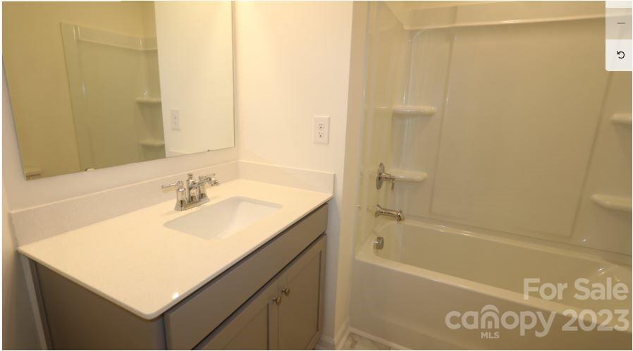2804 Trinity Street Monroe, NC 28110 - Photo 11 of 17 a bathroom with a sink and a bathtub