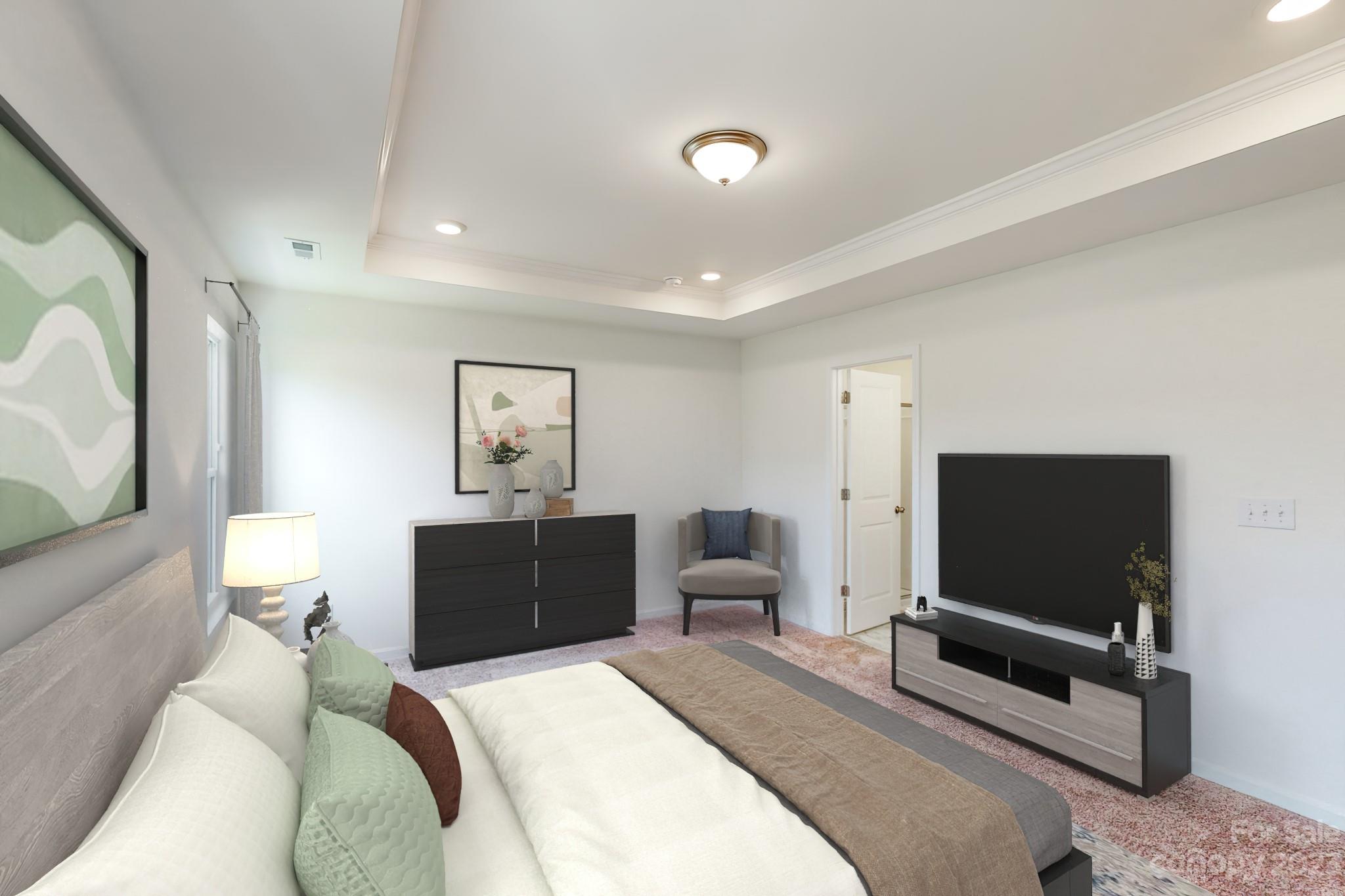 2804 Trinity Street Monroe, NC 28110 - Photo 12 of 17 a bedroom with a bed and a flat screen tv