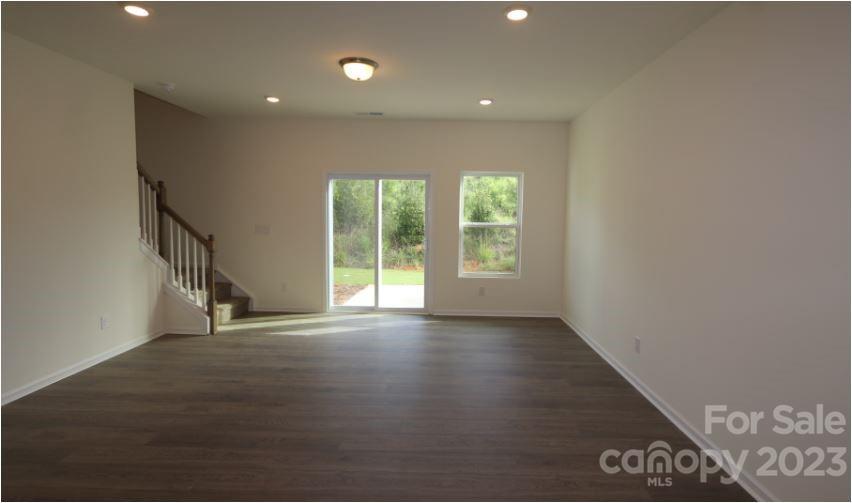 2804 Trinity Street Monroe, NC 28110 - Photo 10 of 17 a view of an empty room with wooden floor and a window