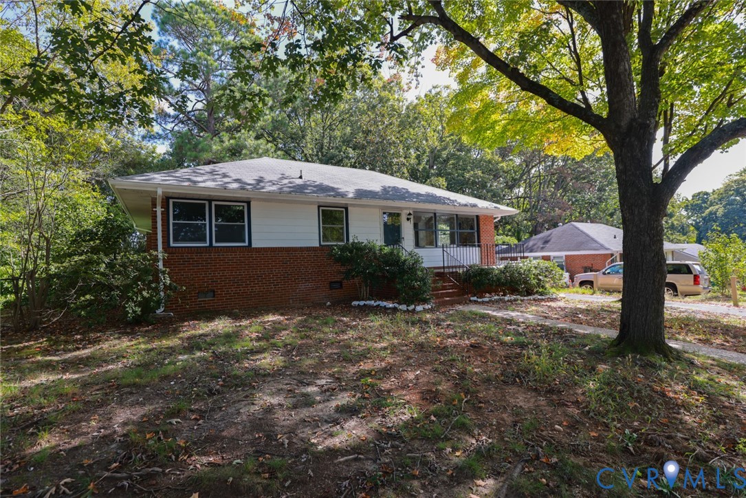 3007 Dunwick Road Richmond, VA 23230 - Photo 1 of 49 Brick and siding exterior with a gabled roof