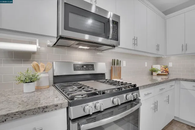 a kitchen with a stove and a microwave