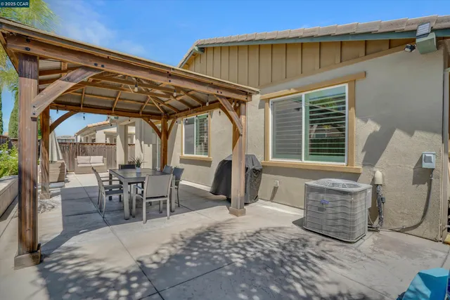 a view of a two chairs in the patio