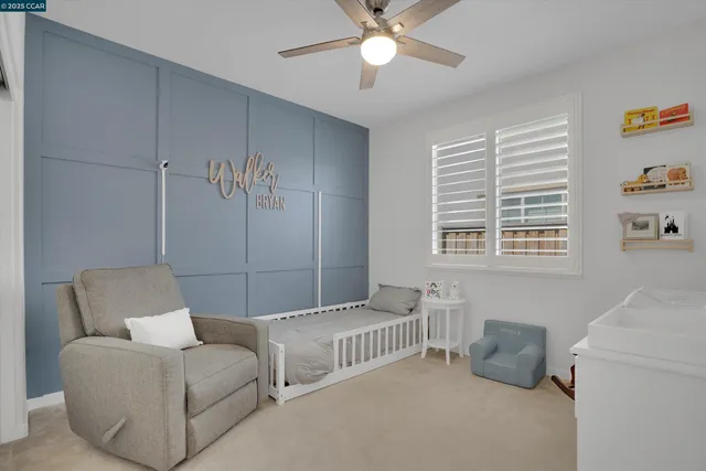 a bedroom with furniture and a window