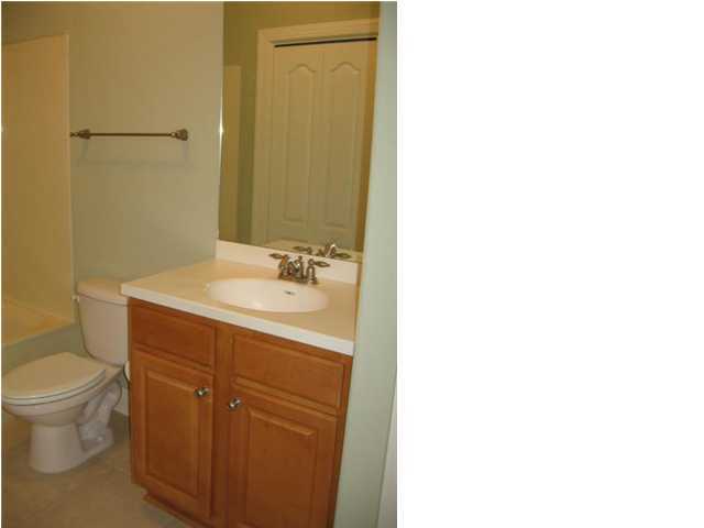 263 Diamond Cove, Unit 263 Destin, FL 32541 - Photo 11 of 24 a bathroom with a sink and a toilet