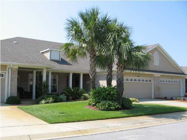 263 Diamond Cove, Unit 263 Destin, FL 32541 - Photo 23 of 24 a front view of a house with a garden