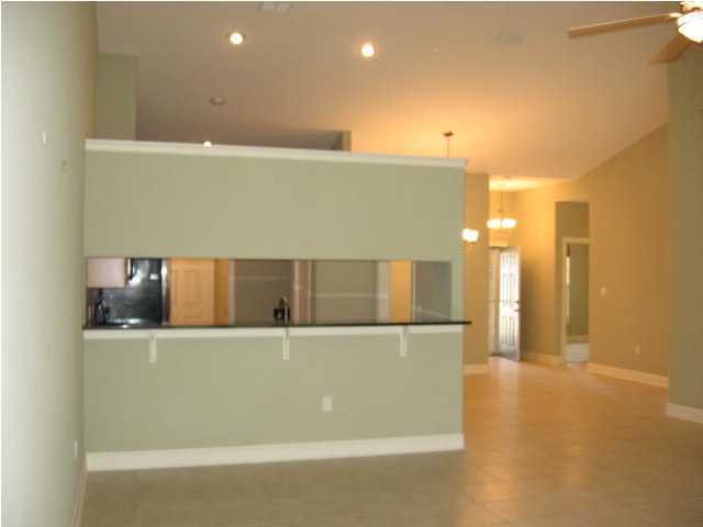 263 Diamond Cove, Unit 263 Destin, FL 32541 - Photo 6 of 24 a view of a refrigerator in a room