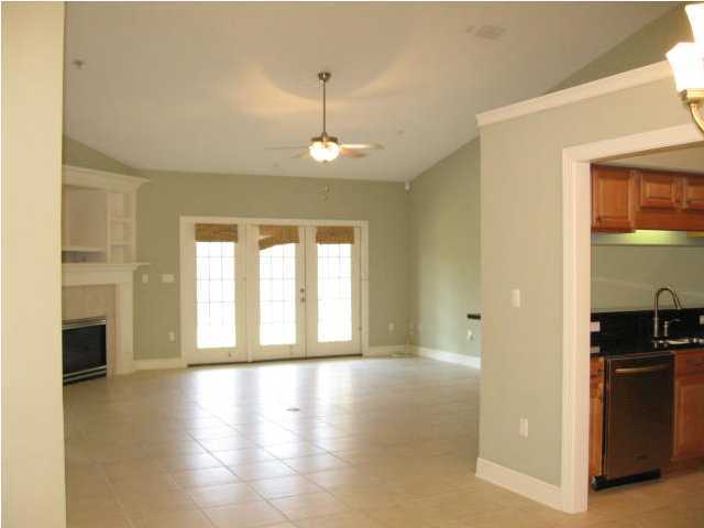 263 Diamond Cove, Unit 263 Destin, FL 32541 - Photo 9 of 24 a view of an empty room with a window and wooden floor