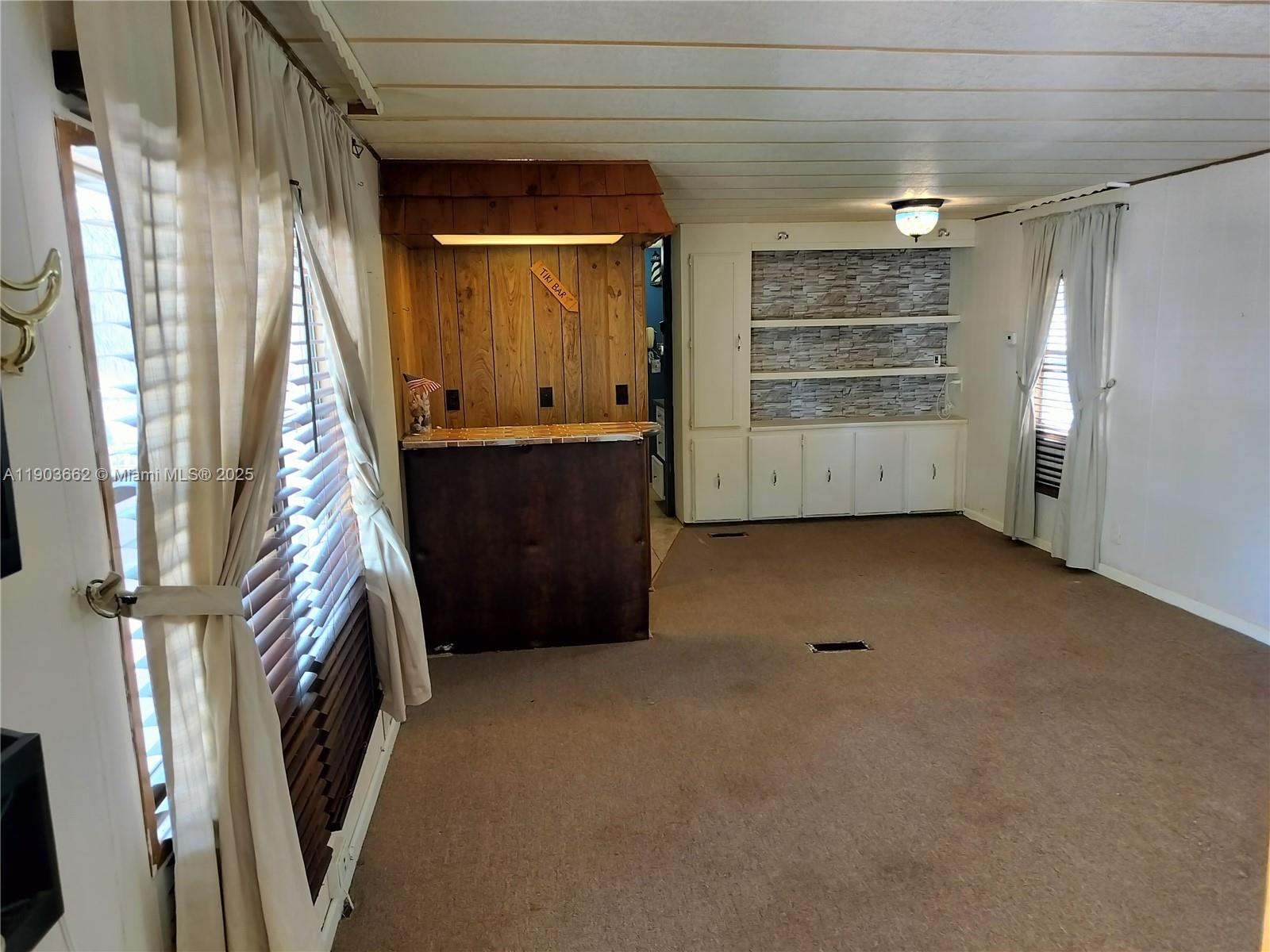 206 West 2nd Court Key Largo, FL 33037 - Photo 42 of 53 a view of an empty room with a fireplace