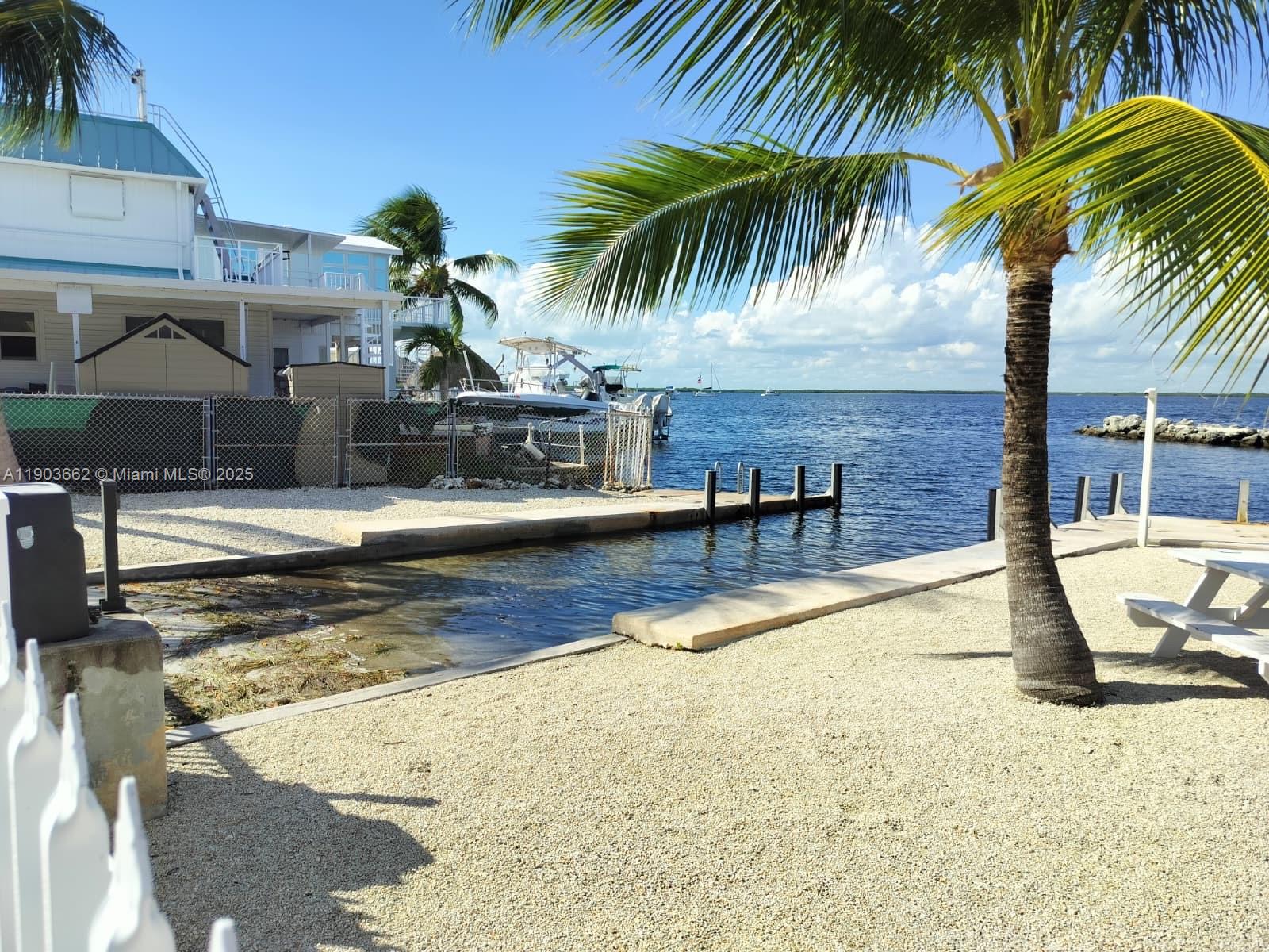 206 West 2nd Court Key Largo, FL 33037 - Photo 46 of 53 a view of a swimming pool with a patio