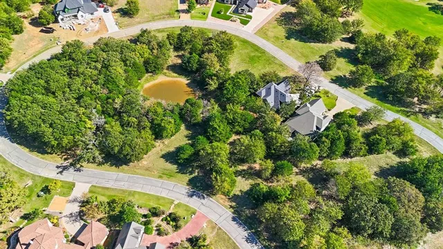 an aerial view of a house with a yard and garden