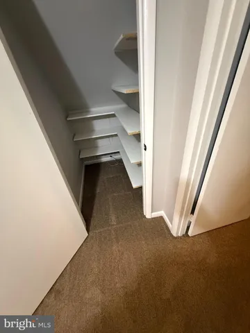 a view of a room with rack on the wall