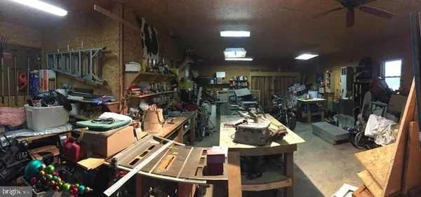 a room with lots of furniture and clutter