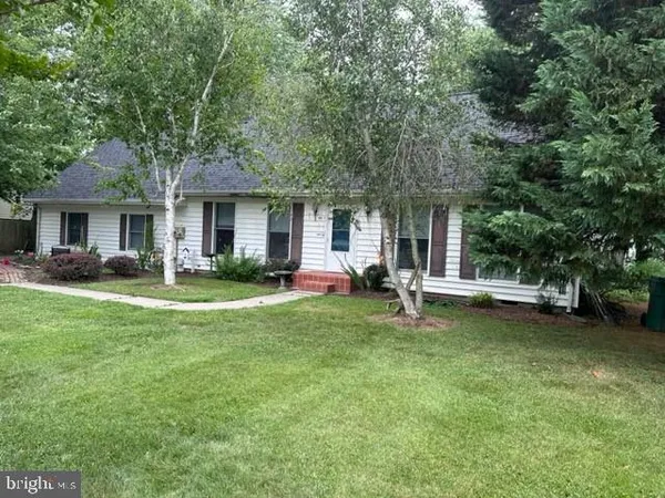 a view of an house with backyard porch and sitting area
